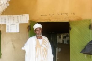 District Head, Muhammad Salisu Jibrin, stands before the shop he donated to serve as a clinic in the absence of a Primary Health Centre in Batsari.