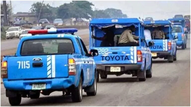FRSC officers on highway patrol with traffic signs in Nigeria
