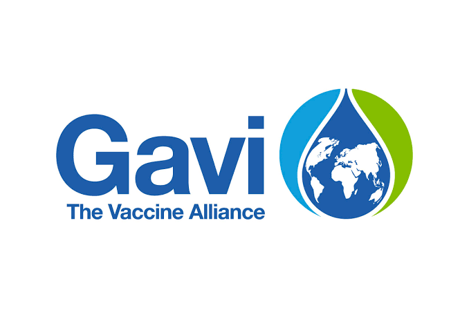 Nigerian health workers administering vaccines to children in rural community