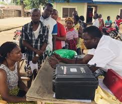 INEC officials assisting Nigerians with voter pre-registration during the Continuous Voter Registration exercise.
