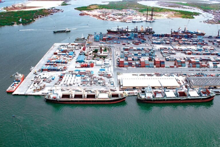 Cargo containers stacked at Apapa Port as Nigeria begins $1 billion reconstruction plan.