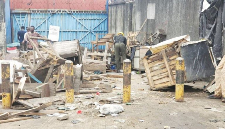 Officials dismantling wooden shanties during Lagos clearance operation