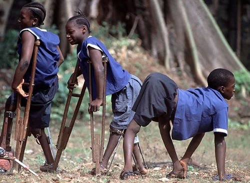 Health workers administering oral polio vaccine to children in Lagos.