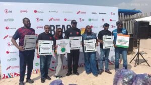 Volunteers cleaning up plastic waste at Alpha Beach Lagos