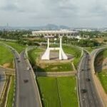 Aerial view of Abuja city districts showing residential and commercial buildings.