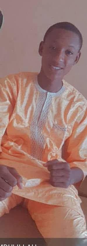 Family members embracing a returned missing person.