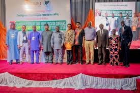 Participants discussing psychology education at PASU Higher Education Conference in Abuja.