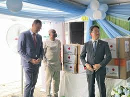 WHO officials handing over cholera response kits to Nigerian health authorities