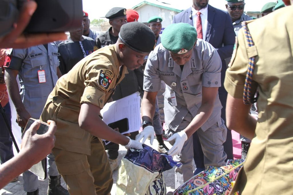 Nigeria Customs officers inspecting seized containers in Kano