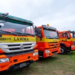 CNG-powered waste compactor trucks at a Lagos State waste management facility