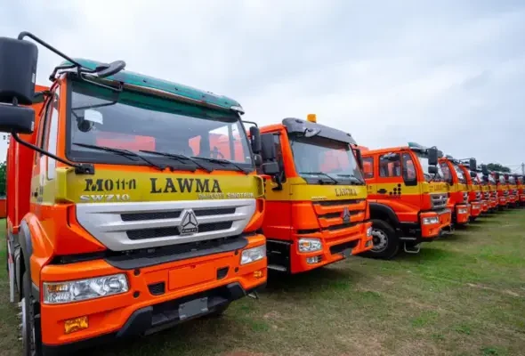 CNG-powered waste compactor trucks at a Lagos State waste management facility