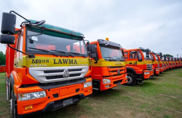 CNG-powered waste compactor trucks at a Lagos State waste management facility