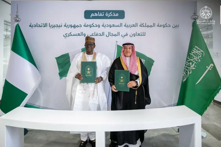 Nigerian and Saudi officials signing defence cooperation agreement