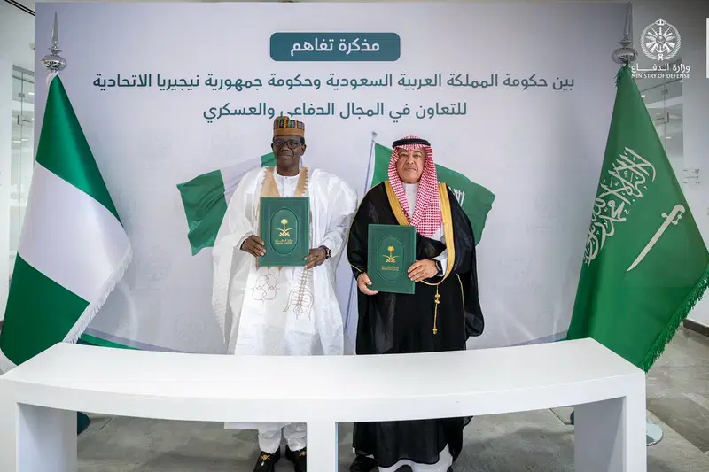 Nigerian and Saudi officials signing defence cooperation agreement