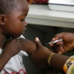Healthcare workers administering measles and rubella vaccines to children in Ondo State