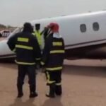 Emergency responders near a private jet at Kano airport