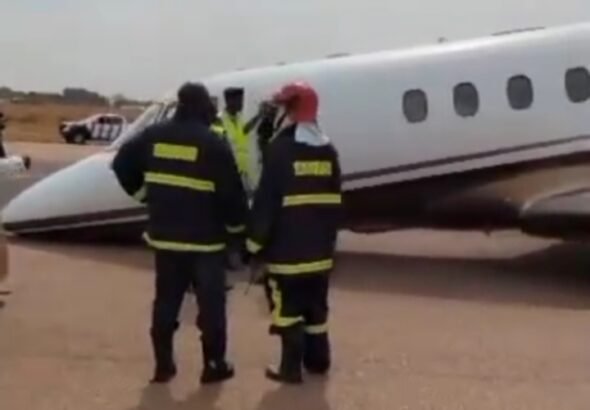 Emergency responders near a private jet at Kano airport