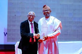 Interior Minister Olubunmi Tunji-Ojo receiving OAU public service award