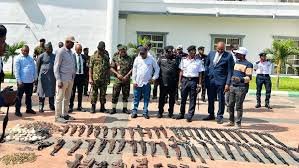 Security operatives displaying seized firearms after Kogi raid