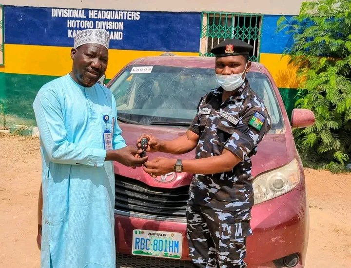 Kano police officers with recovered Toyota Sienna vehicle