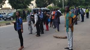 Abuja commuters waiting for public transport amid security concerns