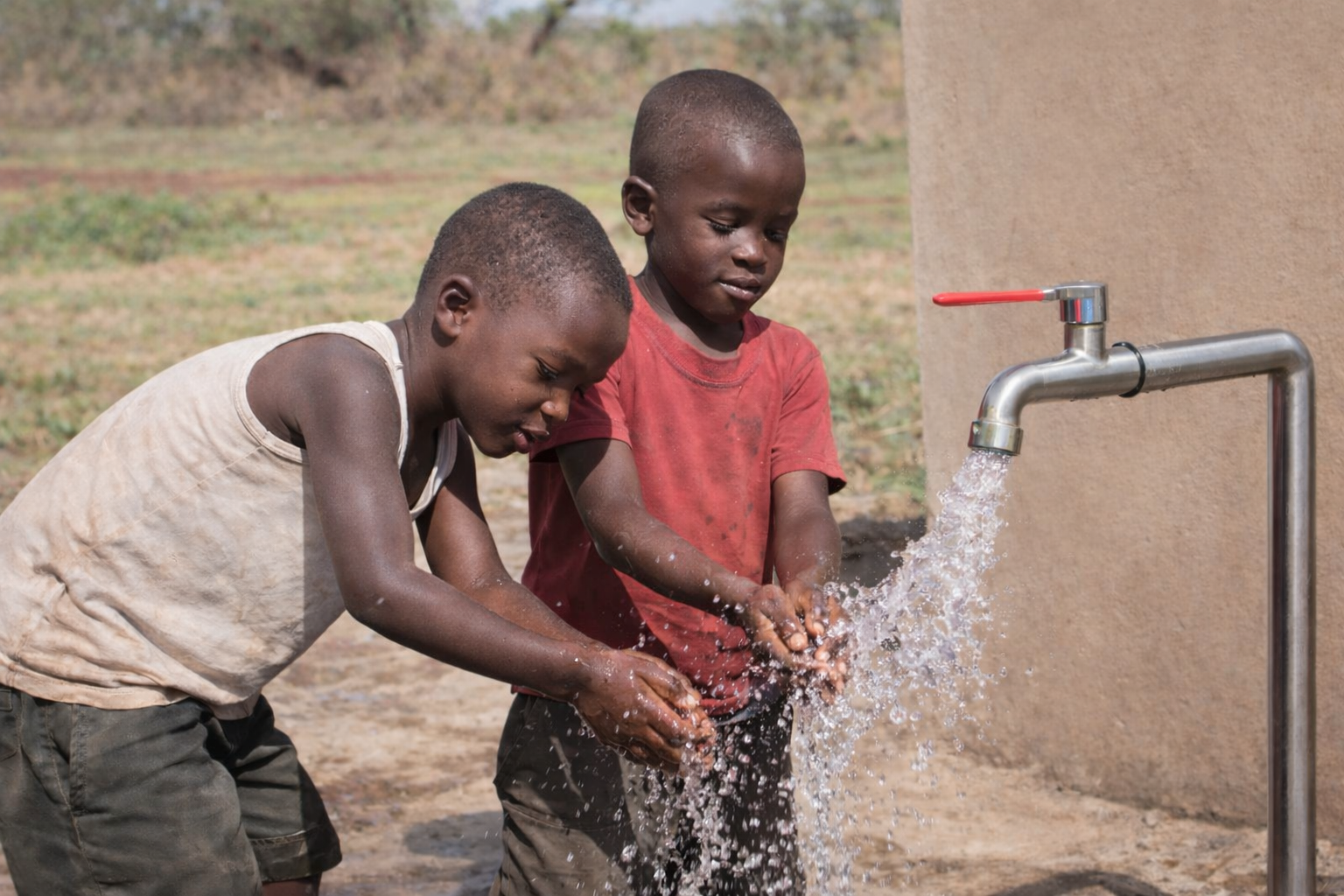 Community water point in rural Nigeria highlighting WASH challenges”