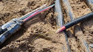 Fibre-optic cables exposed during road construction in Nigeria