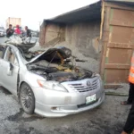 Overturned granite truck crushing a car on Lekki–Ajah Expressway