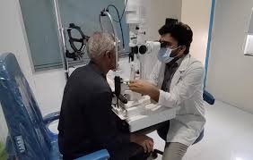 Patient undergoing cataract eye examination in hospital
