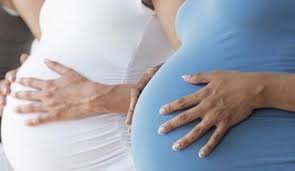 Pregnant woman receiving micronutrient supplements in Nigeria