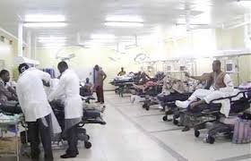 Resident doctors working in an overcrowded Nigerian hospital ward with limited protective equipment