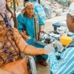 Health workers educating market women during Osun Women’s Day outreach