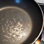 Scratched non-stick cookware used in Nigerian kitchen