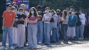 Students queue for meningitis vaccines during UK outbreak in Kent