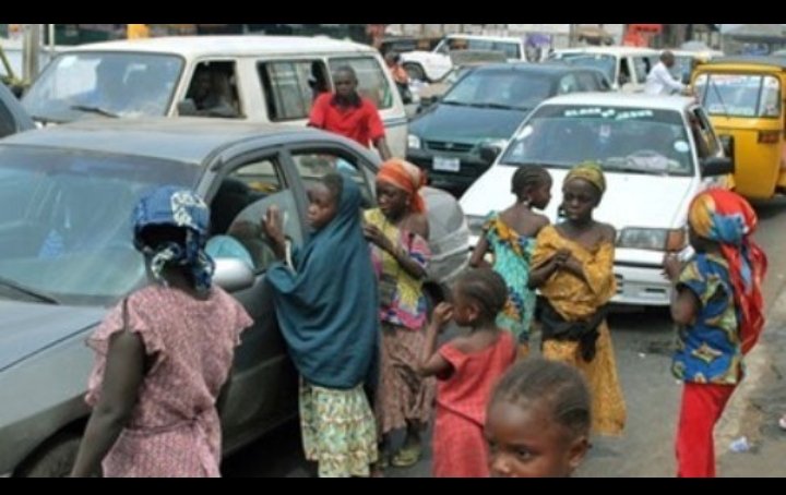 Street beggars along a busy road in Lagos