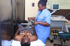 Doctor explaining sodium balance to patient in Nigerian clinic