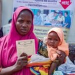 Female health workers conducting vaccination outreach in Nigerian community