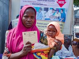 Female health workers conducting vaccination outreach in Nigerian community
