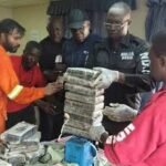 NDLEA officers displaying seized cocaine in Lagos