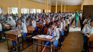 Secondary school students in classroom during lesson in Abuja