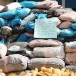 Seized cannabis bags displayed by NDLEA operatives