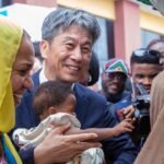 Healthcare workers vaccinating children during immunisation campaign in Lagos