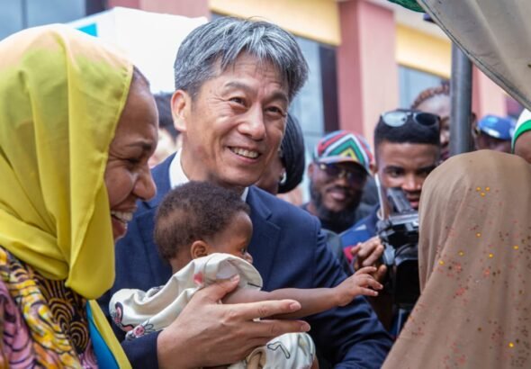 Healthcare workers vaccinating children during immunisation campaign in Lagos