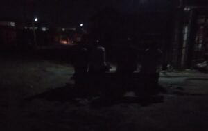 Children and residents sleeping outdoors during a prolonged blackout in Kubwa, Abuja.