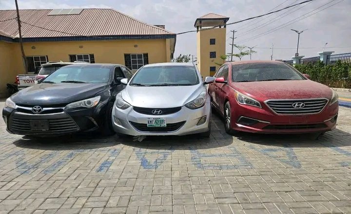 Recovered stolen vehicles displayed by Kano State Police Command after syndicate bust