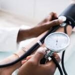 Young Nigerians undergoing blood pressure checks during a hypertension awareness campaign