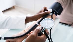 Young Nigerians undergoing blood pressure checks during a hypertension awareness campaign