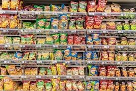 Processed food products on shelves highlighting nutrition and health concerns