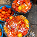 Spoiled fungus-infested tomatoes displayed in a Lagos market