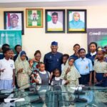 Education Minister Maruf Alausa celebrating Children’s Day with children and disability advocate Dera Osadebe in Abuja